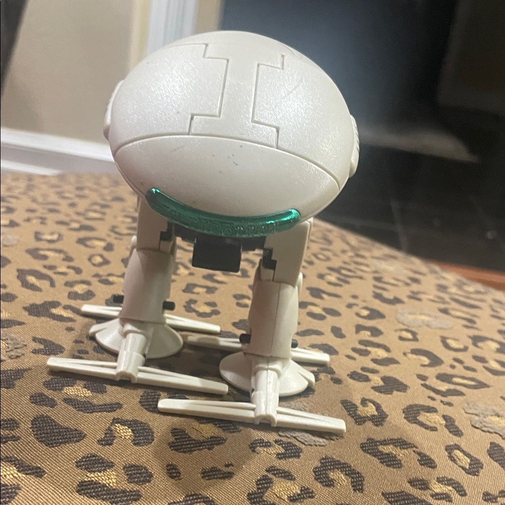 White Robot Toy with Green Details